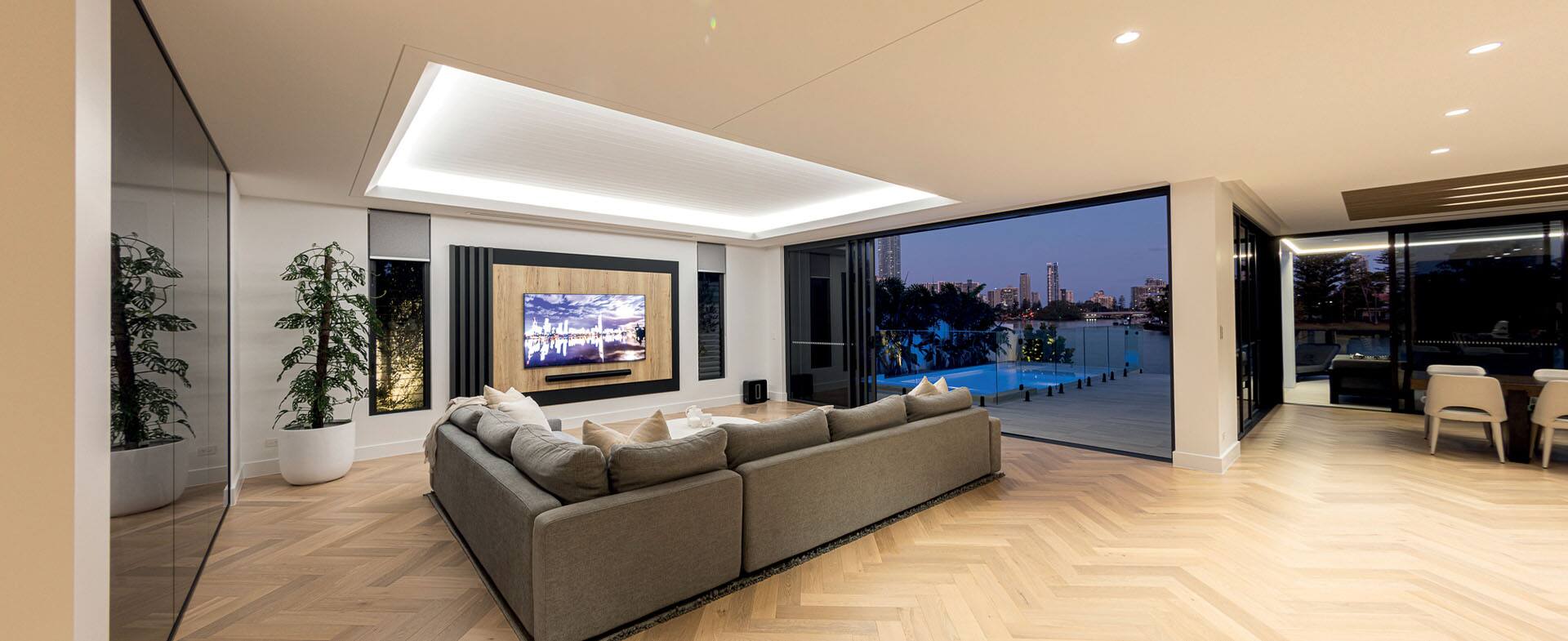Open-plan Melbourne living room with herringbone timber flooring